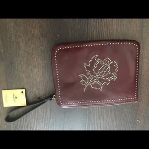 Red zipper wristlet with tags